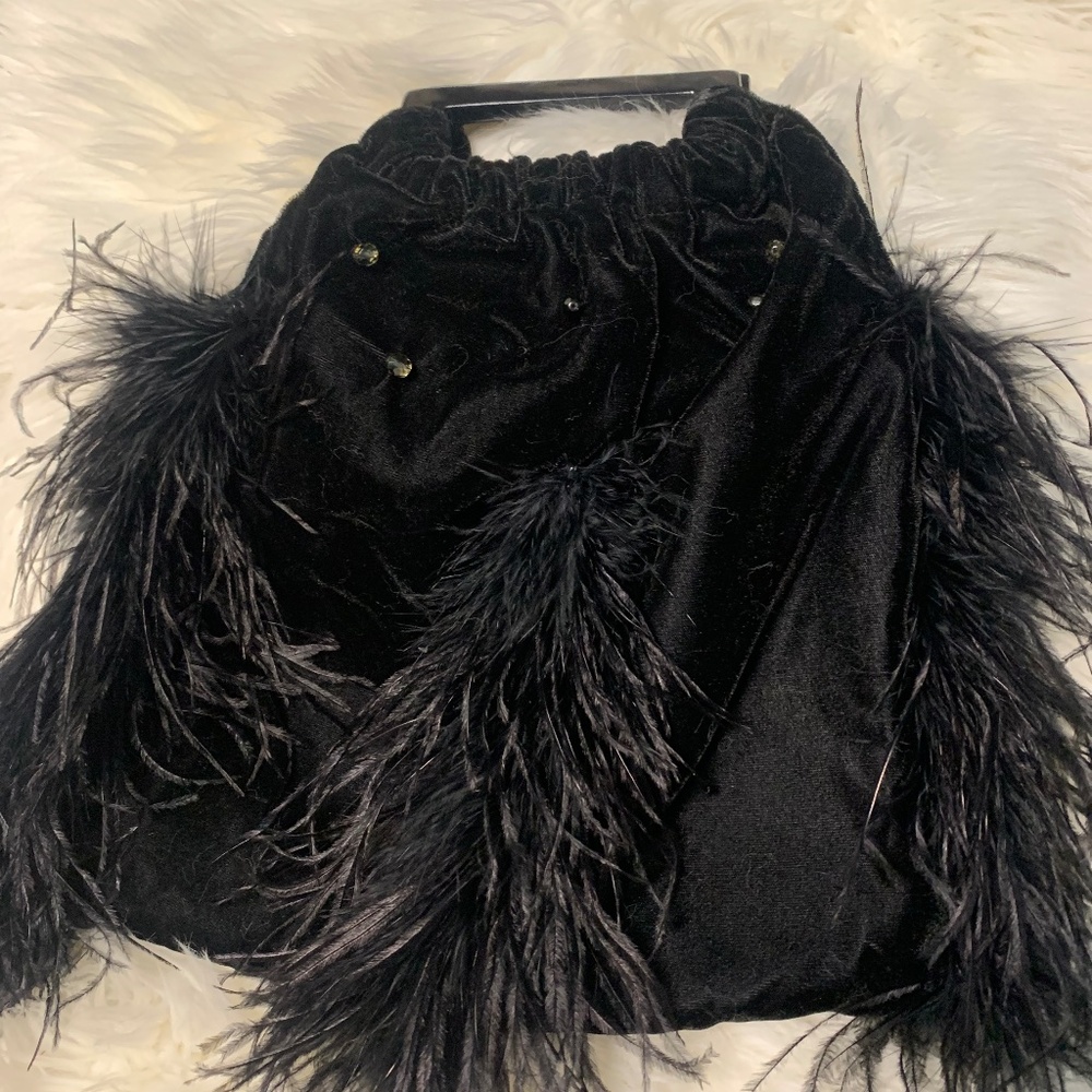 Black velvet handbag with feather trim